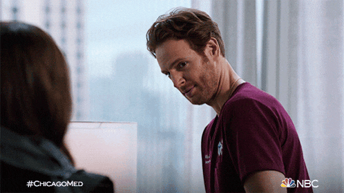 a man in a purple shirt is talking to a woman in a chicagomed ad