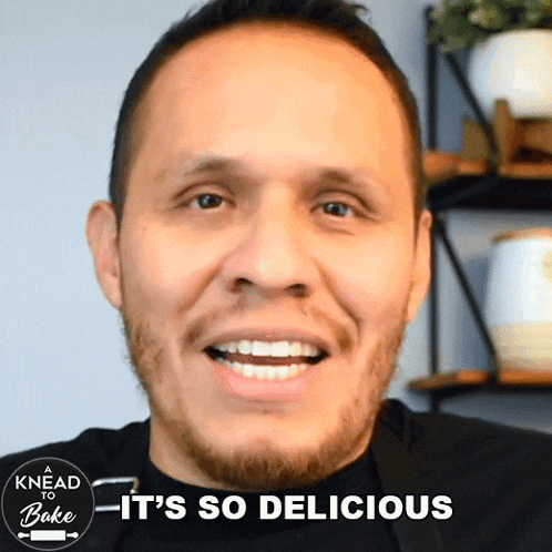 a man is smiling with the words " it 's so delicious " above him