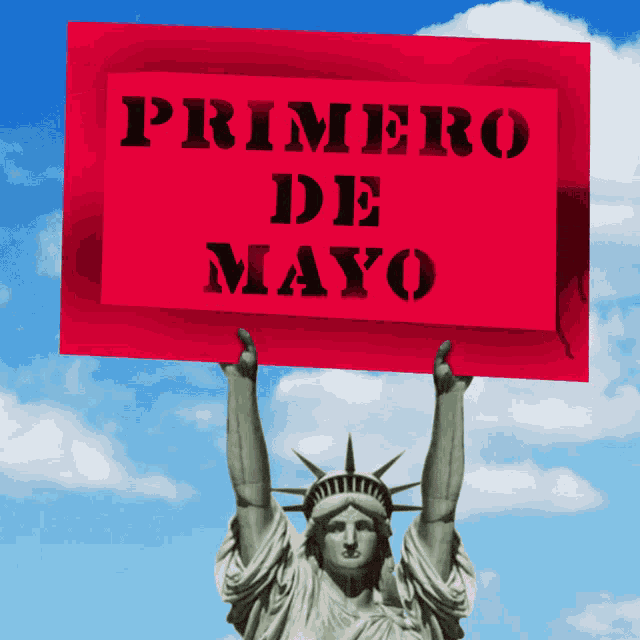 a statue of liberty holds up a sign that says primero de mayo