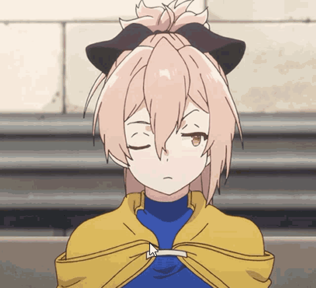 a girl with a bow in her hair is making a face