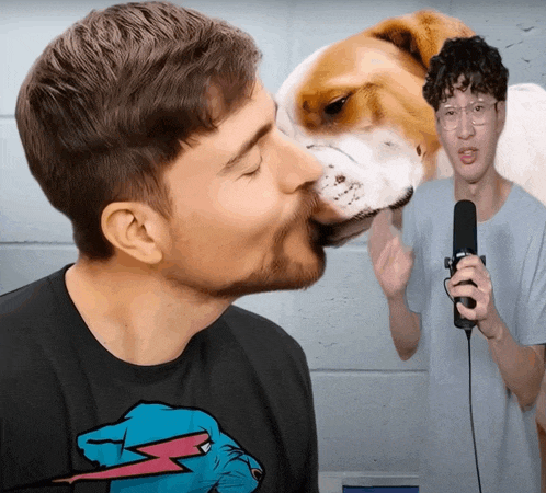 a man kisses a dog on the nose while another man holds a microphone in the background