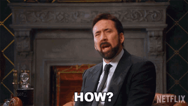 a man in a suit and tie is asking the question how