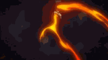 a man is standing in front of a fireball in a dark room in a fairy tail anime .
