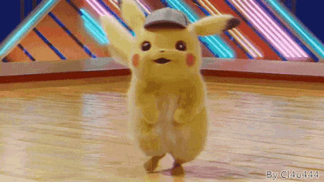 a pikachu with a hat is dancing on a stage