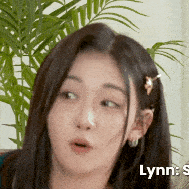 a close up of a woman 's face with lynn 's written below it