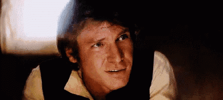 a close up of a man 's face in a dark room with a blurred background .