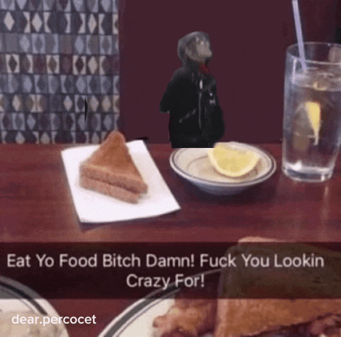 a snapchat of a person sitting at a table with a plate of food and a glass of water with a lemon slice
