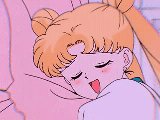 a close up of a cartoon girl sleeping on a bed with her mouth open .
