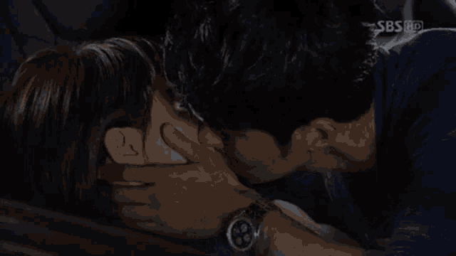 a man and woman are kissing in the back seat of a car with sbs hd written on the screen