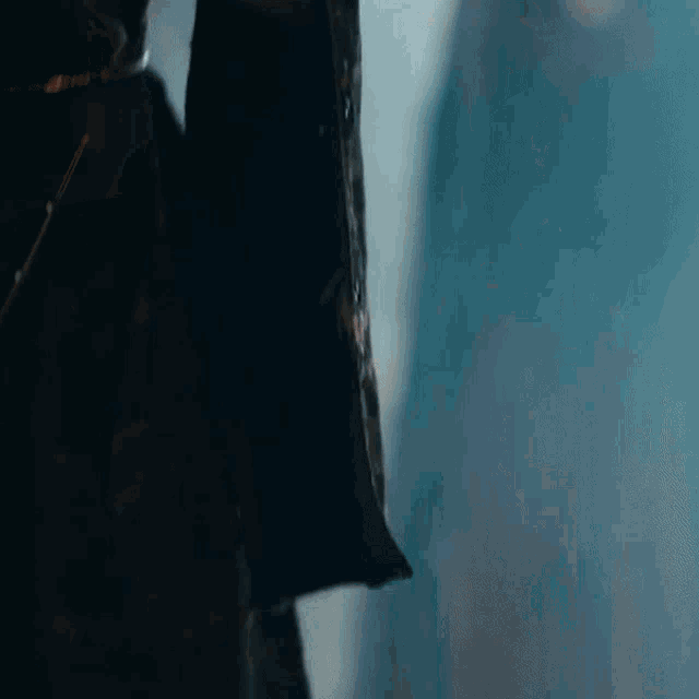 a close up of a person 's arm with a dark background