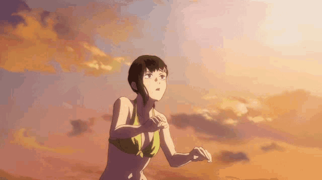 a girl in a bikini looks up at the sky