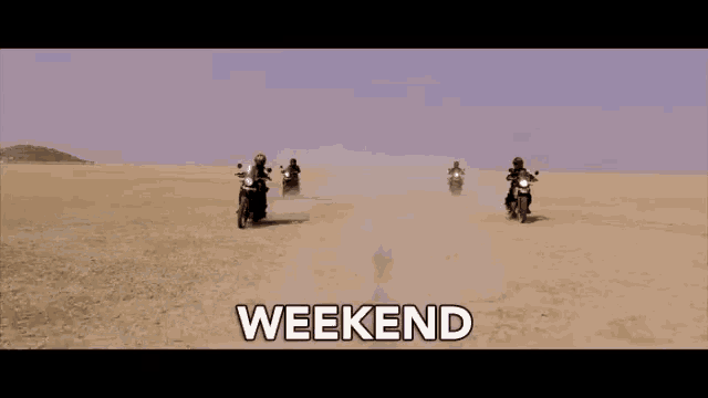 a group of people are riding motorcycles in the desert and the word weekend is written above them