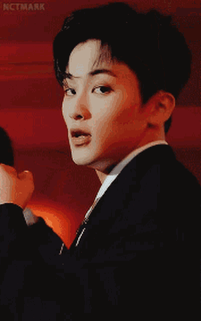 a close up of a man 's face with the word nctmark on the bottom right