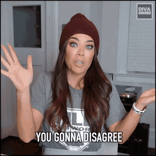 a woman wearing a beanie and a t-shirt that says you gonna disagree