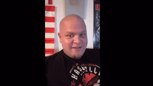 a bald man with a beard wearing a black shirt that says nashville