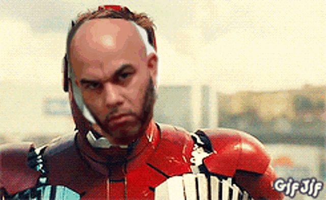 a man in an iron man costume has a gif gif written on the bottom