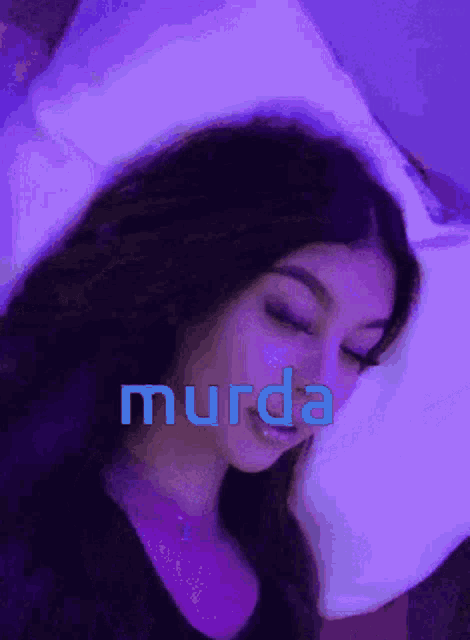 a woman laying on a bed with the word murda written on the bottom
