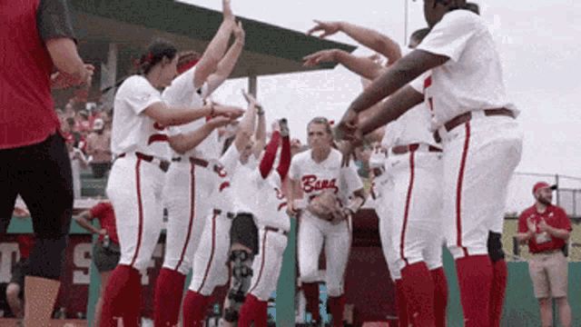 a group of baseball players with one wearing a shirt that says ' bulls '