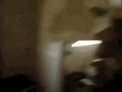 a blurry image of a person standing in a room