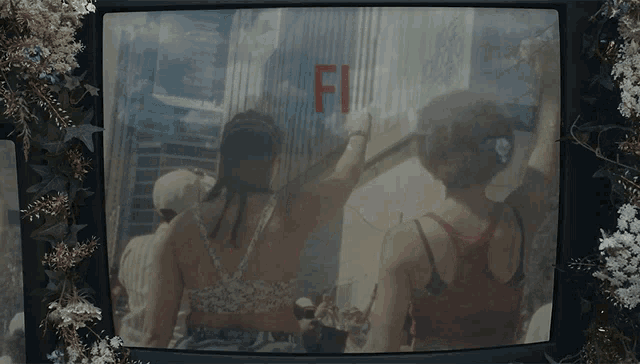 a tv screen shows a group of people and the words fi be under pressure