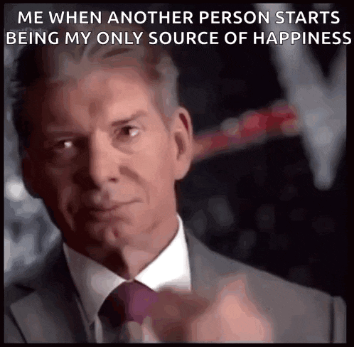 a man in a suit and tie says me when another person starts being my only source of happiness .