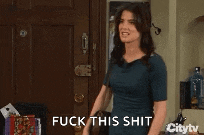 a woman is standing in front of a door giving the middle finger and saying `` fuck this shit '' .