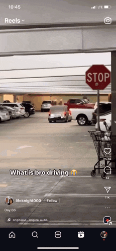 a stop sign in a parking lot with a car parked behind it