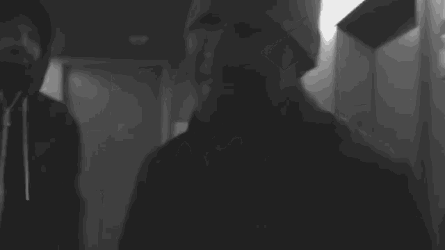 a black and white photo of a man with the words i want them now below him