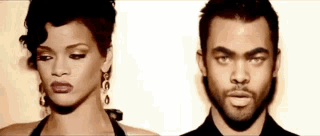 a woman and a man are standing next to each other .