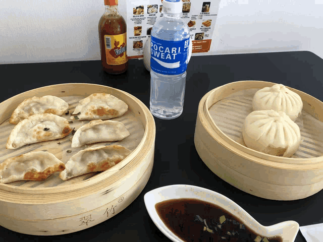 a bottle of pocari sweat sits on a table with food