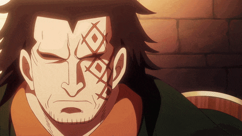 a man with a tattoo on his face looks angry