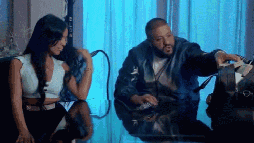 a man and a woman are sitting at a table talking