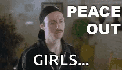 a man with a mustache is wearing a hat and a black shirt and says `` peace out girls '' .