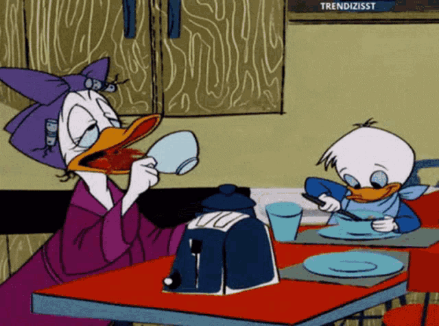 a cartoon of daisy duck and donald duck sitting at a table drinking coffee