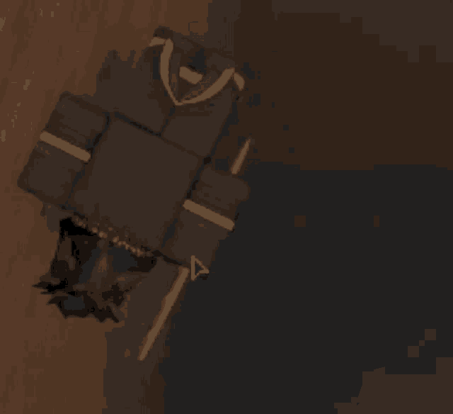 a person is laying on a wooden floor with a wallet on it