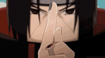 a close up of itachi uchiha 's hand with a ring on it .