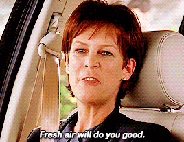 a woman sitting in a car with the words fresh air will do you good