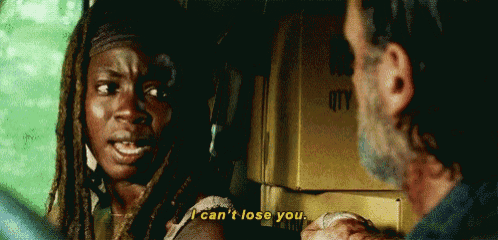 a man and a woman are talking in front of a box that says ' i can 't lose you ' on it