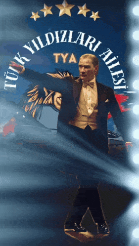 a man in a tuxedo is standing in front of a sign that says turk yildizlari ailesi tya