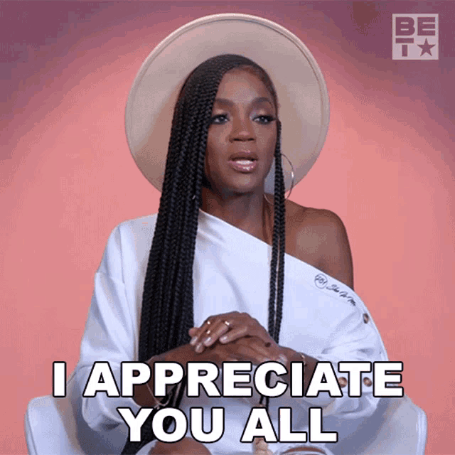 a woman wearing a hat and a white shirt says i appreciate you all