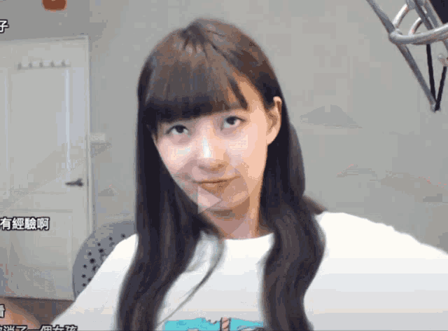 a girl with chinese writing on the bottom of the screen