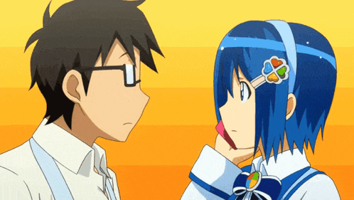 a boy and a girl are looking at each other and the girl has a flower in her hair