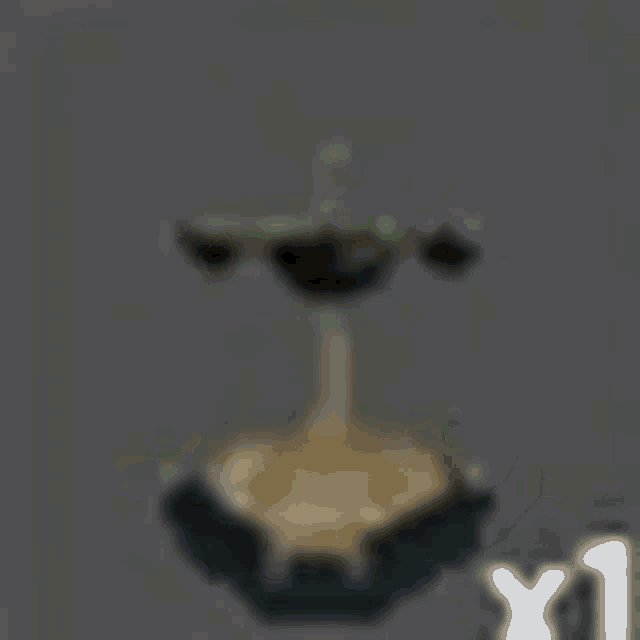 a 3d model of a scale on a gray background