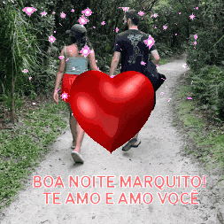 a man and a woman are walking down a path with a red heart in the middle