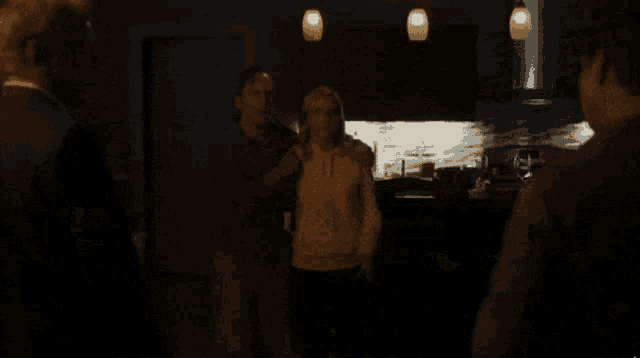 a man in a suit is being shot with a gun