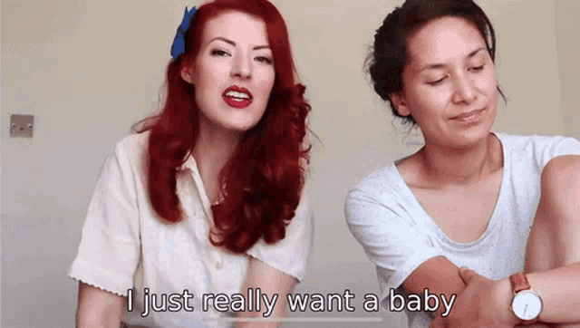two women are sitting next to each other and one of them is saying " i just really want a baby "