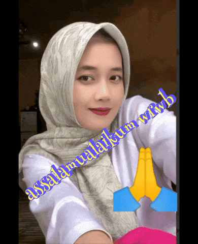 a woman wearing a hijab and a white shirt with the words assalamualaikum written on it