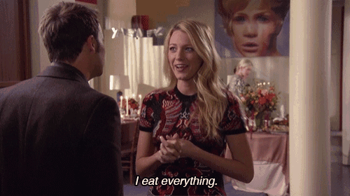 a woman says " i eat everything " in front of a man