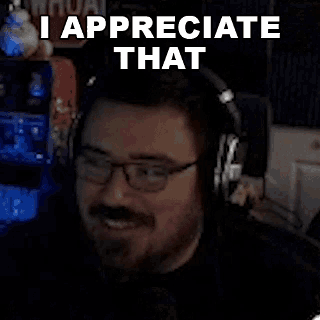a man wearing headphones and glasses is saying i appreciate that