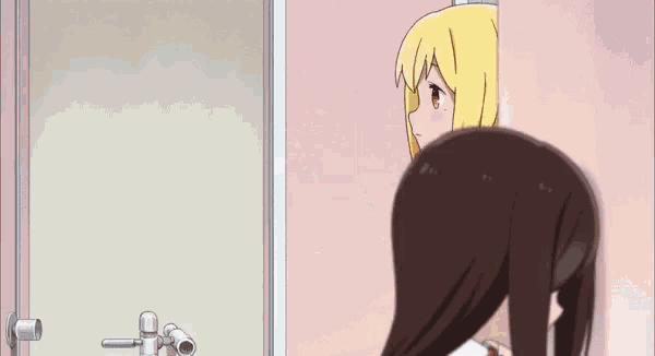 a girl with blonde hair stands next to another girl with brown hair